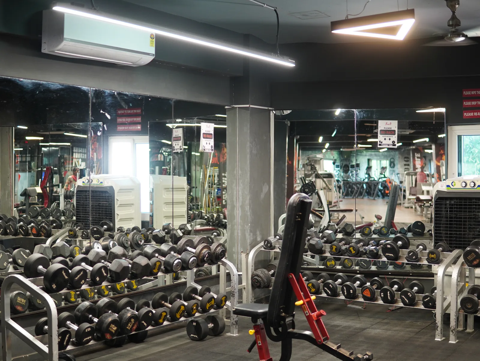Free weights and dumbbell racks at Fitness9 Karkhana, gym near Marredpally